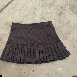Mini pinstripe pleated skirt, buttons the the side as well as the zipper.